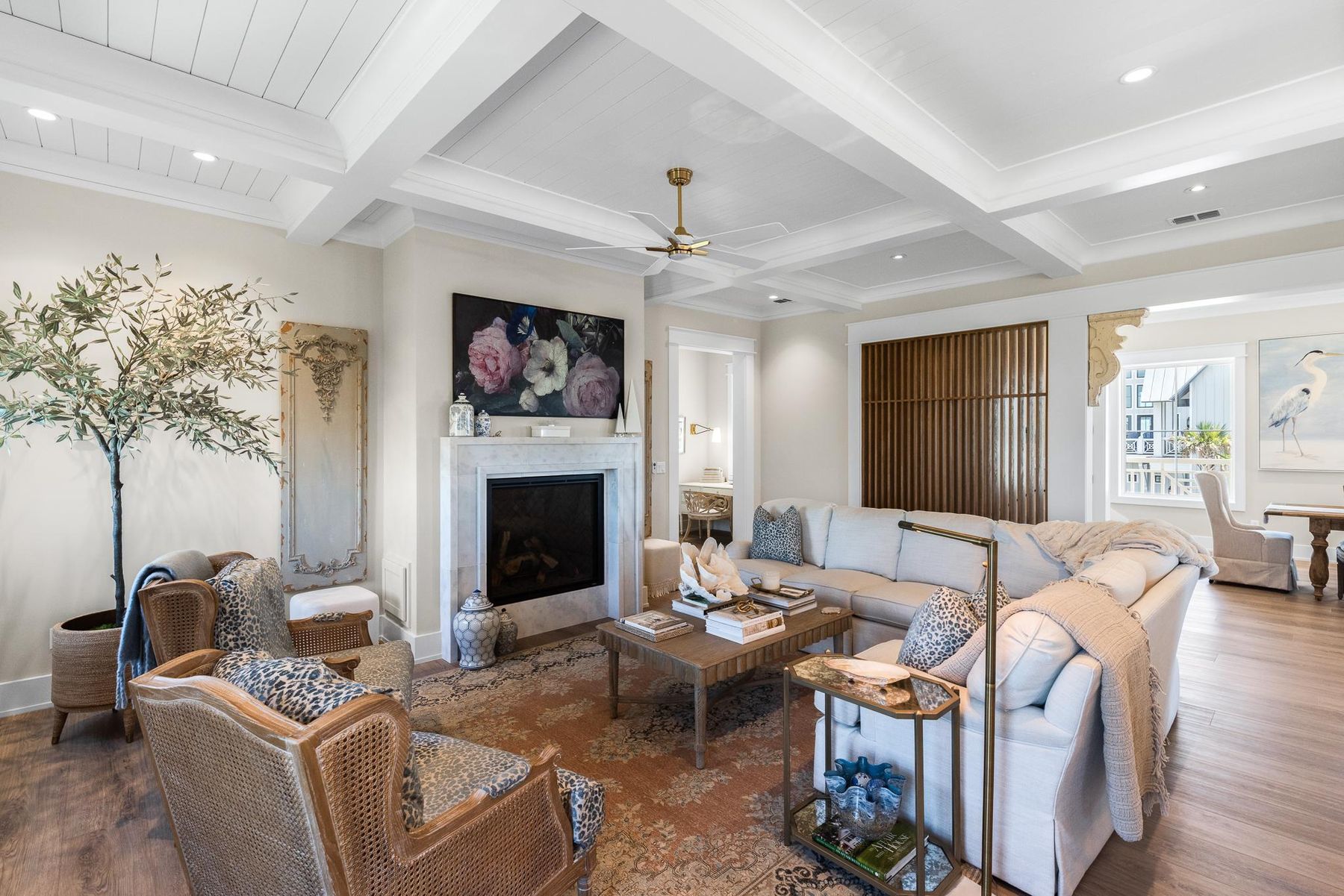 Living room with a coffered ceiling and fireplace