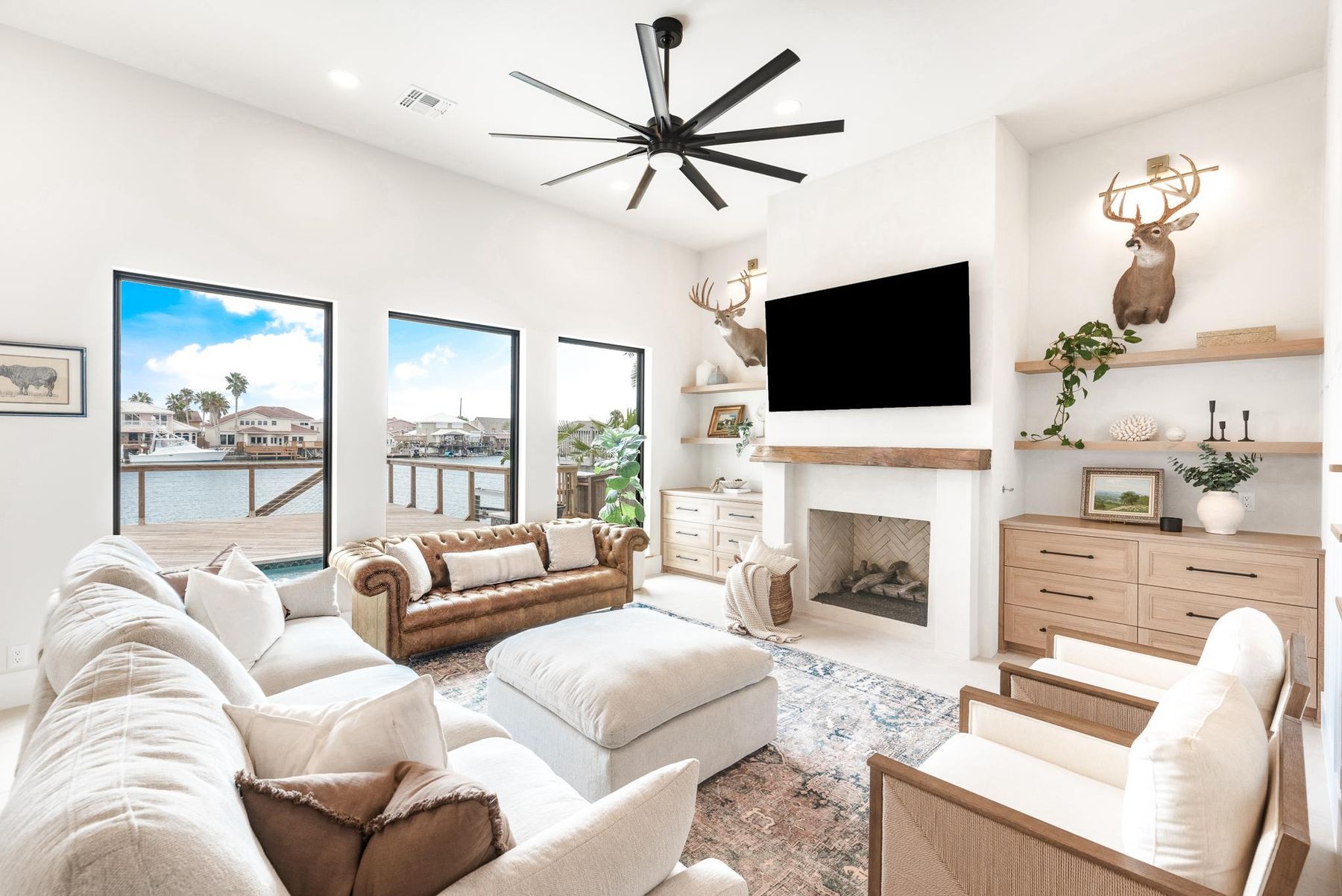 Living room with a fireplace and canal views