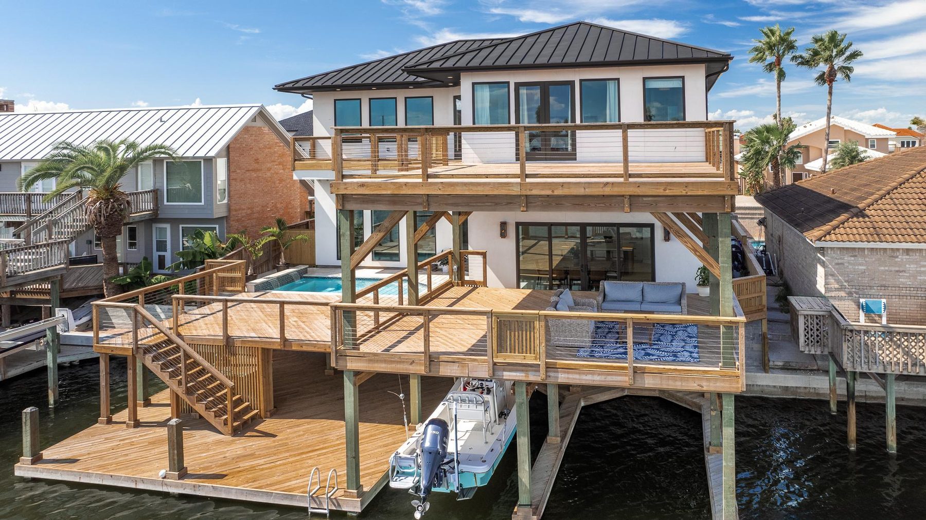 A Christensen waterfront custom home with multi-level decks and a private boat dock