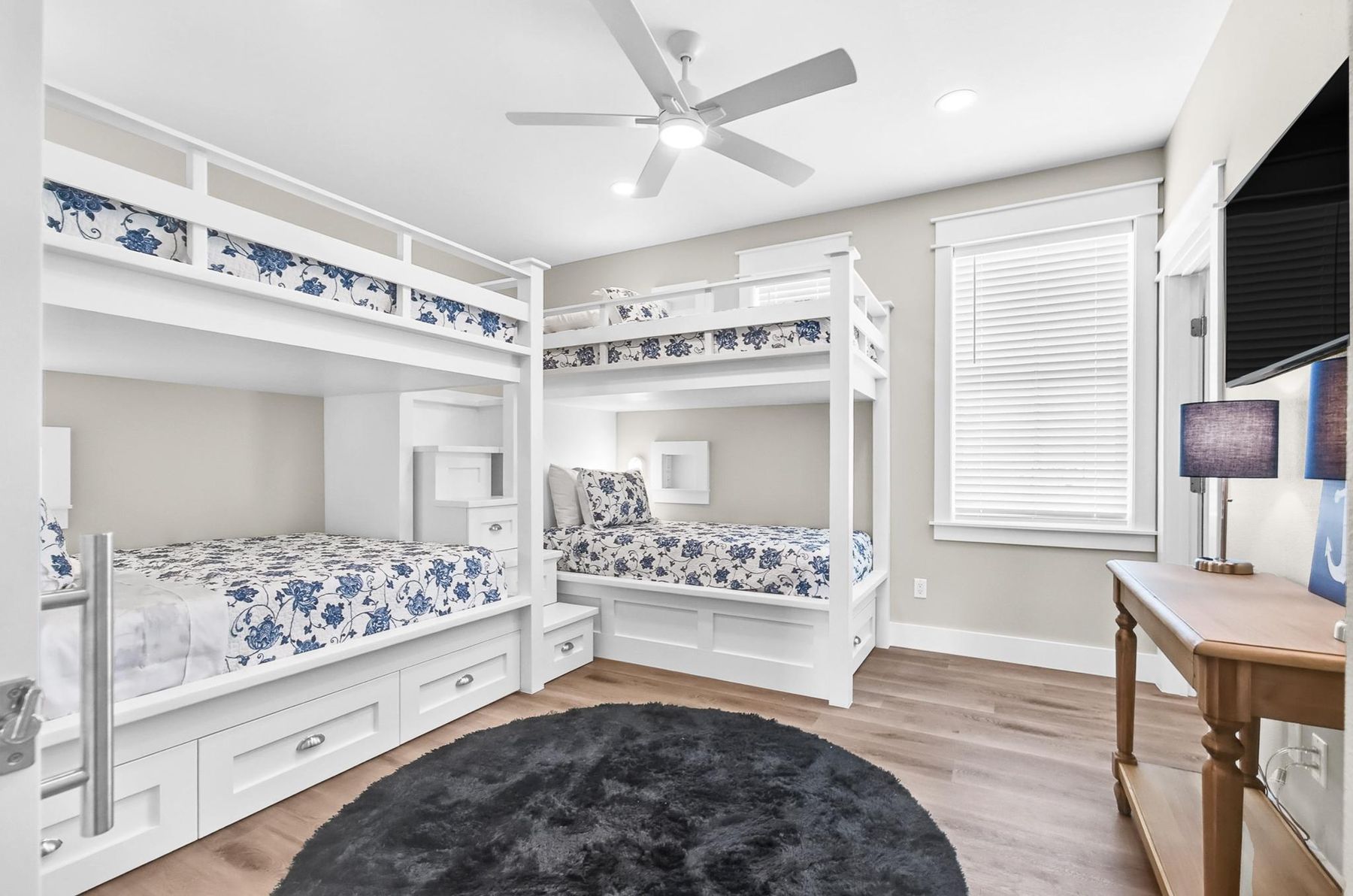 Built-in bunk room with blue floral bedding